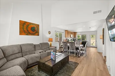 a living room with a couch and a table at Fun Family Retreat Games, Massage Chair & Yard in Mission Viejo