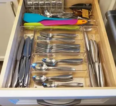 a drawer full of silver utensils in a drawer at Entire Private Home with 3 Bedrooms, Gated Yard, Parking, King Bed, Available Now in Spring Valley