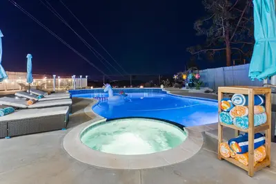 a pool at night with a swimming pool at Upscale Resort House, Views, Saltwater Pool, Spa in Spring Valley