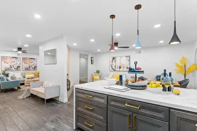 a kitchen with a counter and a living room at Upscale Resort House, Views, Saltwater Pool, Spa in Spring Valley