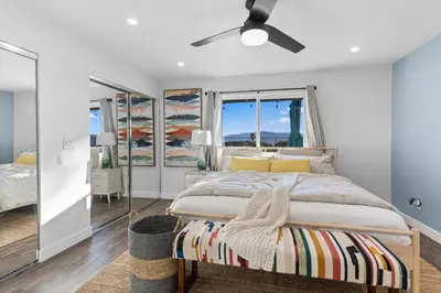 a bedroom with a bed and a ceiling fan at Upscale Resort House, Views, Saltwater Pool, Spa in Spring Valley