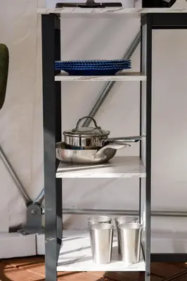 a shelf with a pot and three cups on it at A Quiet Fireside Retreat in a Scenic Glamping Dome in Fallbrook