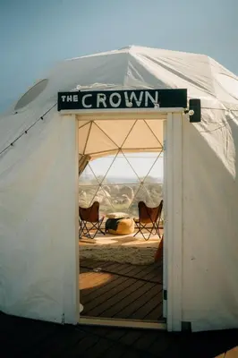 a white tent with a sign that reads the growin at A Cozy Fireside Glamping Escape with Ridge Views in Fallbrook