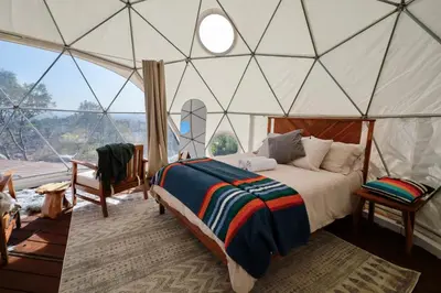 a bedroom with a bed in a tent at Cozy Dome Hideaway with Sweeping Sunrise View in Fallbrook