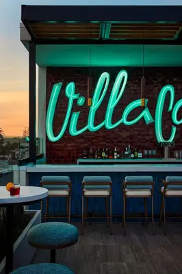 a neon sign on a bar in a restaurant at The Bower Coronado in San Diego