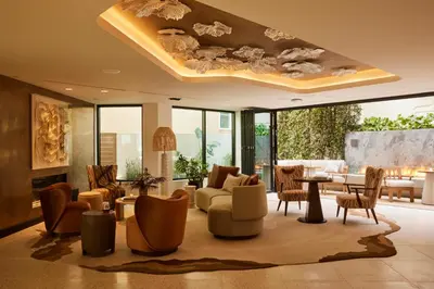 a living room filled with furniture and a large ceiling at The Bower Coronado in San Diego