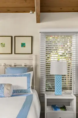 a bedroom with a bed with a lamp and a window at Classic Cottage in the Heart of La Jolla Shores in San Diego