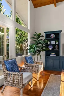 a living room with two chairs and a table at Classic Cottage in the Heart of La Jolla Shores in San Diego