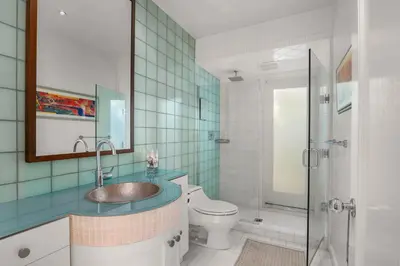a bathroom with a sink and a toilet at Classic Cottage in the Heart of La Jolla Shores in San Diego
