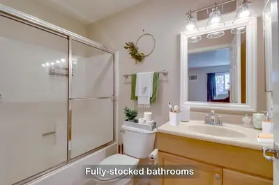 a bathroom with a shower and a toilet and a sink at Entire Private Home with 3 Bedrooms 2 Bathrooms, Family Home Free Pool, Tub and Parking, Available Now in Chula Vista