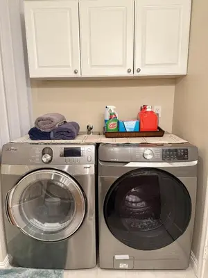 a washing machine and a washer in a kitchen at Entire Private Home with 3 Bedrooms 2 Bathrooms, Family Home Free Pool, Tub and Parking, Available Now in Chula Vista