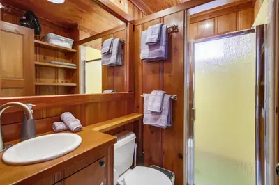 a bathroom with a toilet and a sink and a shower at Surf Cottage 2 in San Diego