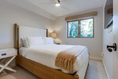a bedroom with a large bed and a window at Marine Dream in San Diego