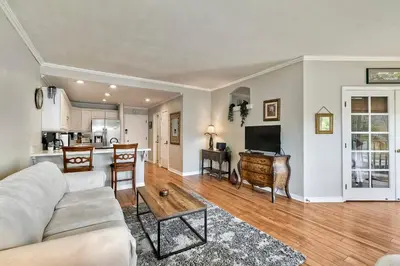 a living room with a couch and a table at La Costa Condo Pool BBQ Gated Parking in Carlsbad