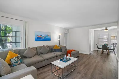 a living room with a couch and a table at 500 ft to Ocean Relaxing stay Parking WiFi 834 in San Diego