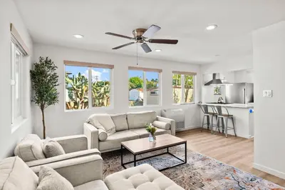 a living room with a couch and a table at Parkside Paradise in San Diego