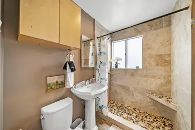 a bathroom with a sink and a shower at Parkside Paradise in San Diego