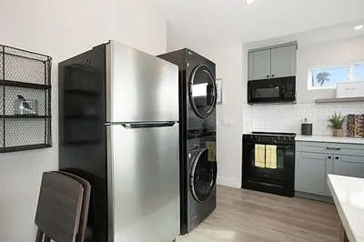 a large stainless steel refrigerator in a kitchen at New with Panoramic View in Sunset Cliffs in San Diego