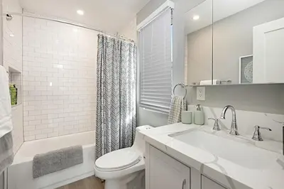a white bathroom with a sink and a toilet at New with Panoramic View in Sunset Cliffs in San Diego