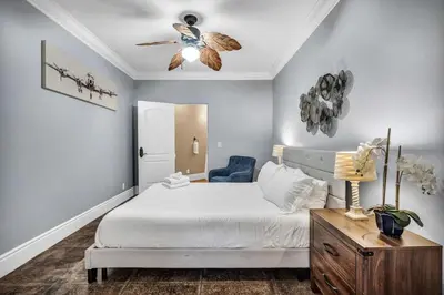 a bedroom with a bed and a ceiling fan at Secluded Boulder Groves Resort Getaway! in Ramona