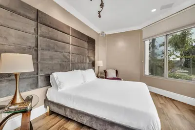 a bedroom with a large white bed and a window at Secluded Boulder Groves Resort Getaway! in Ramona
