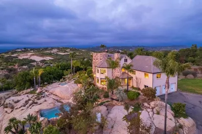 an aerial view of a house on a rocky hill at Secluded Boulder Groves Resort Getaway! in Ramona