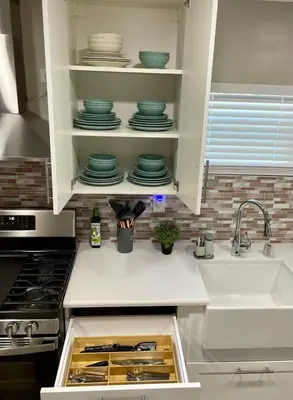 a kitchen with a sink and a counter with dishes at North Park Centrally located 8Br 5Ba House in San Diego