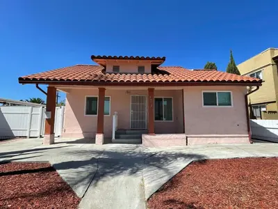 a small house with a red roof at North Park Centrally located 8Br 5Ba House in San Diego
