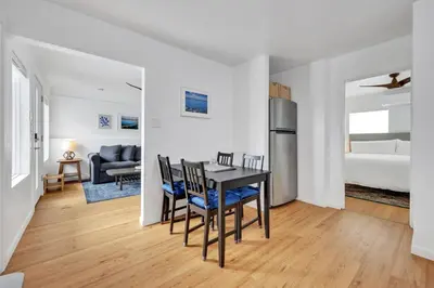a kitchen and dining room with a table and chairs at Harborside Suite 12 with Hot Tub and King Beds in San Diego