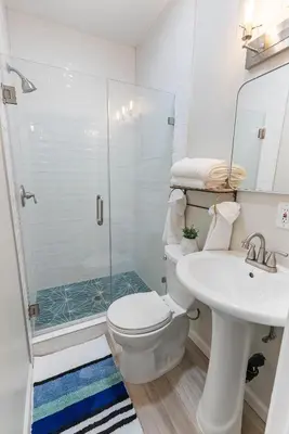 a bathroom with a shower and a toilet and a sink at San Diego Large Luxury home near Downtown in San Diego