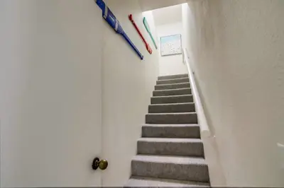 a staircase in a room with a stair case at Beryl Bungalow in San Diego