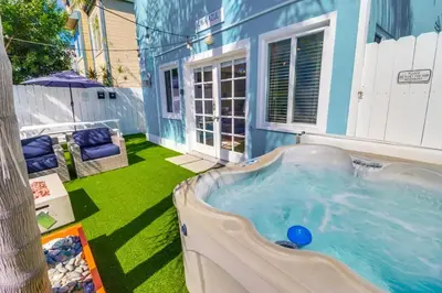 a hot tub in the backyard of a house at Casa Azul Lower in San Diego