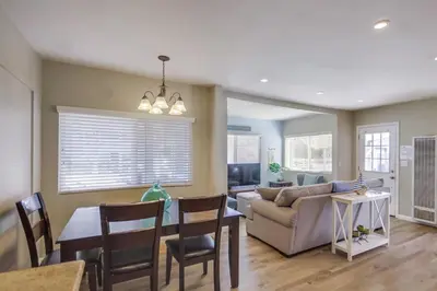 a living room with a couch and a table at Cozy Kingston 1 in San Diego