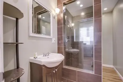 a bathroom with a sink and a shower at Cozy Kingston 1 in San Diego