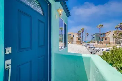 a blue door with a view of a street at Manhattan Shores 1B in San Diego