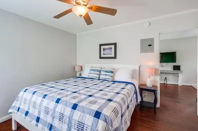 a bedroom with a bed and a ceiling fan at Manhattan Shores 1B in San Diego