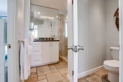 a bathroom with a toilet and a sink at Ocean Breeze 1 in San Diego