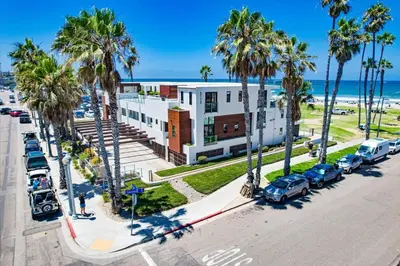 an aerial view of a street with palm trees and a building at Ocean Park 08 in San Diego