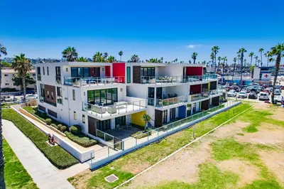 an aerial view of a large white building with a parking lot at Ocean Park 03 in San Diego