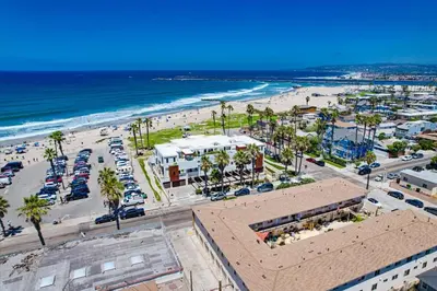 an aerial view of a beach with palm trees and cars at Ocean Park 05 in San Diego