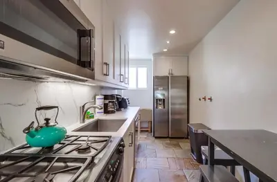 a kitchen with a stove with a teapot on it at Surf Rider D in San Diego