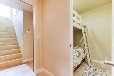 a bedroom with a bunk bed and a staircase at Ocean View Luxury 2 in San Diego