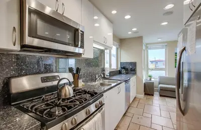 a kitchen with a stove and a sink at Ocean View Luxury 2 in San Diego
