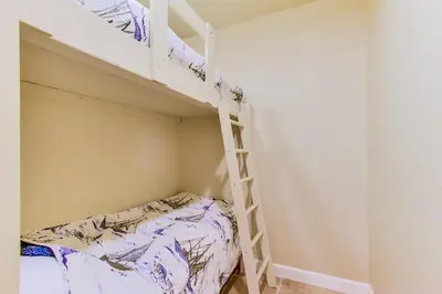 a bedroom with a bunk bed and a ladder at Ocean View Luxury 2 in San Diego