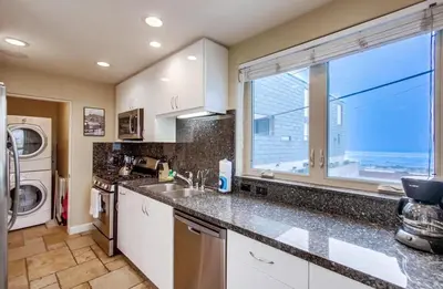 a kitchen with a sink and a window at Ocean View Luxury 2 in San Diego