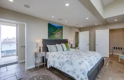 a bedroom with a large bed and a large window at Ocean View Luxury 2 in San Diego