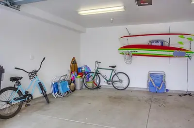 a garage with two bikes parked in a room at Pacific Pearl in San Diego