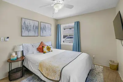 a bedroom with a white bed and a window at 500 ft to Ocean Relaxing stay Parking WiFi 840 in San Diego