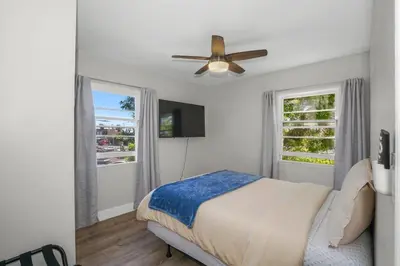 a bedroom with a bed and a ceiling fan at 500 ft to Ocean Relaxing stay Parking WiFi 836 in San Diego
