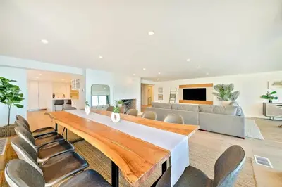 a large living room with a large table and chairs at Cliffside Haven Where Ocean Meets Sky in San Diego